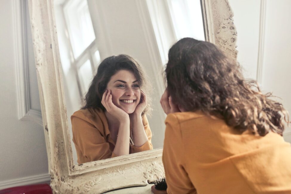 Truth of Same Day Implants Woman Smiling in Mirror, Same Day Implants