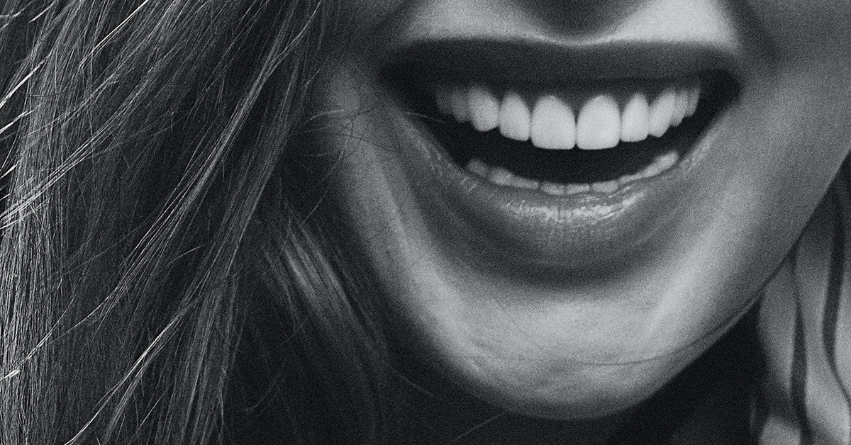 Woman with mouth open, how safe are dental implants