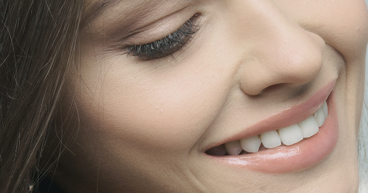 Woman Smiling, can you turn dentures into implants
